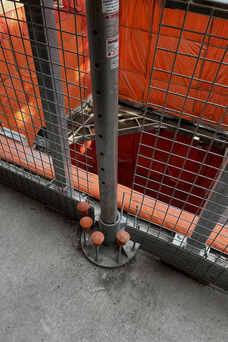 The davit mast and floor mount base at the shaft edge
